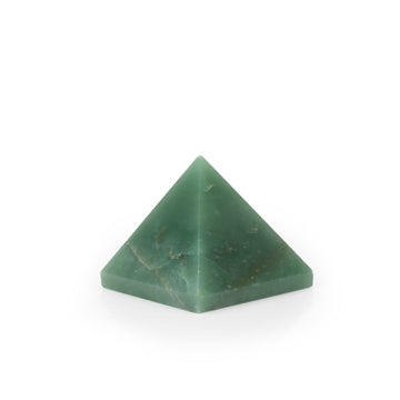 Small green quartz crystal pyramid for healing and meditation.